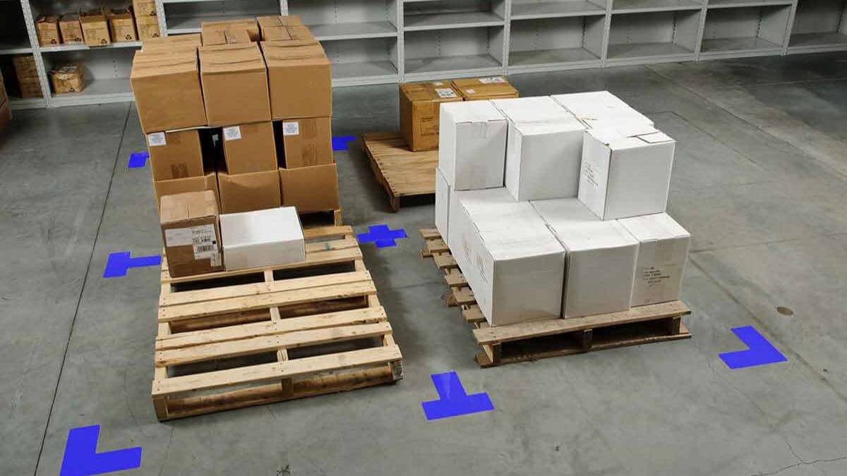 Warehouse pallet zone marked with blue floor tape using 5S organization principles