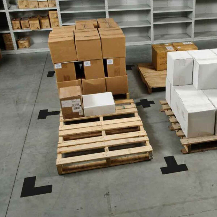 Warehouse pallet zone outlined with black floor marking tape for 5S visual control and inventory organization