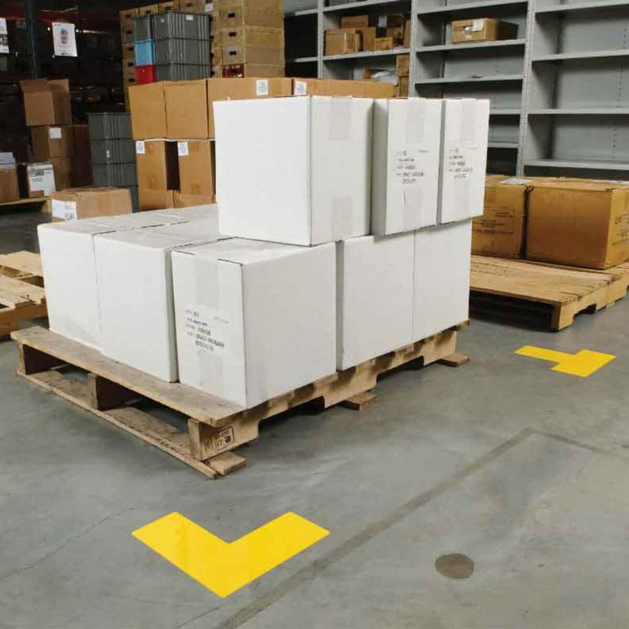 Pallet storage area marked with yellow corner floor tape in a warehouse, supporting 5S visual organization and safety